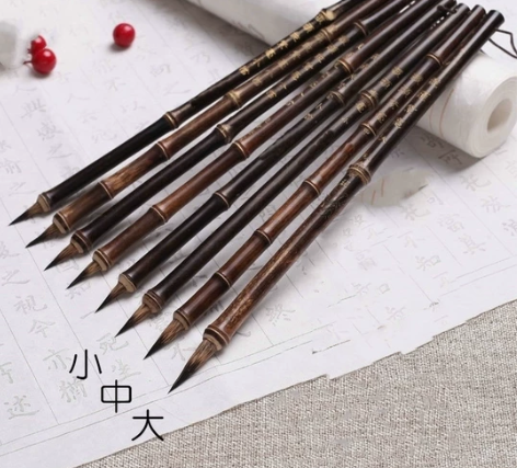 两支起卖,兔毛毛笔。小,20一支,中25一...