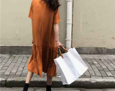 HG黑哥 橘色慵懒风连衣裙女简约冷淡风荷叶...